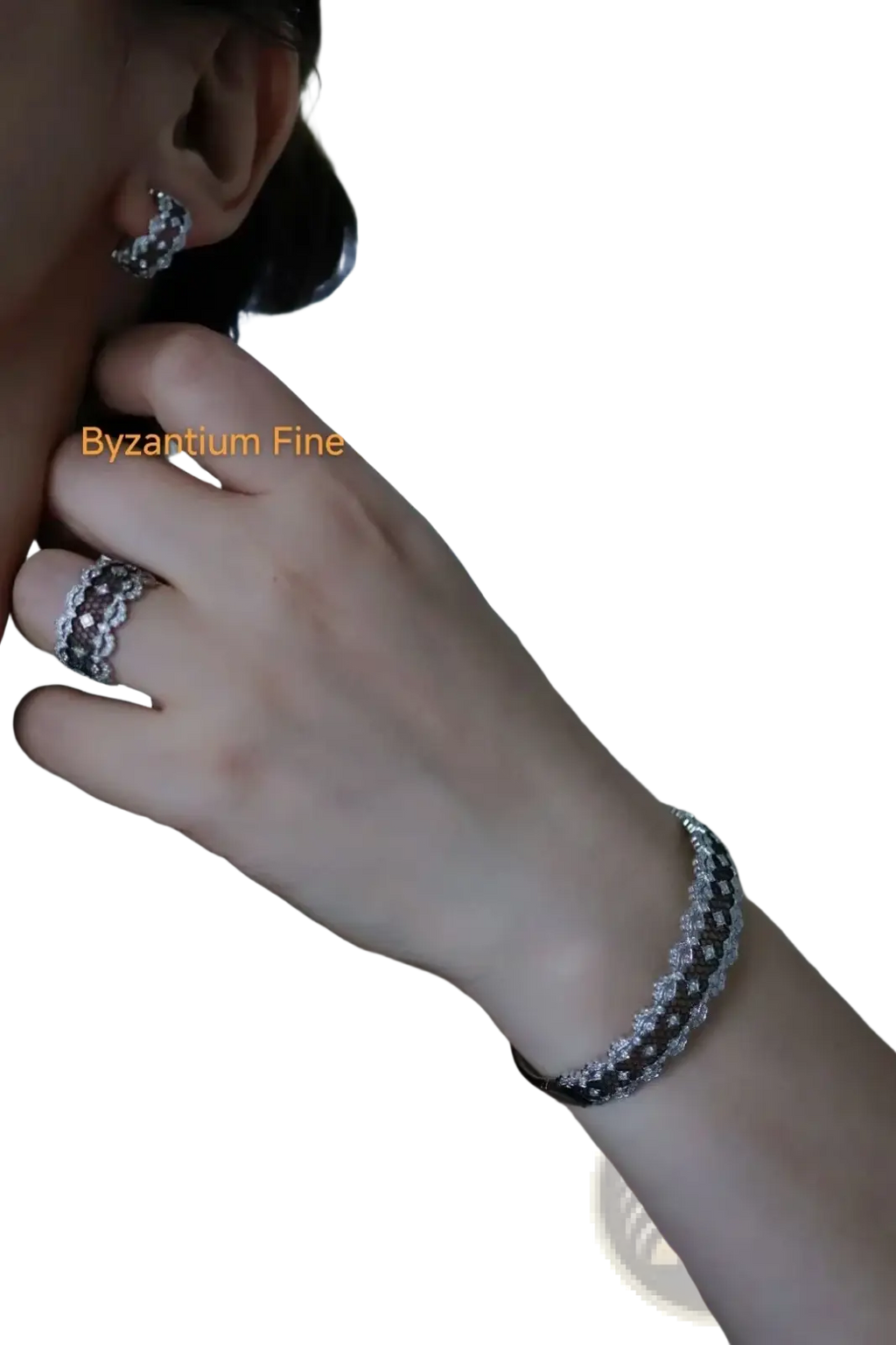 Silver-toned bracelet with textured pave-set diamond pattern complementing silver teardrop tassel earrings gold vermeil