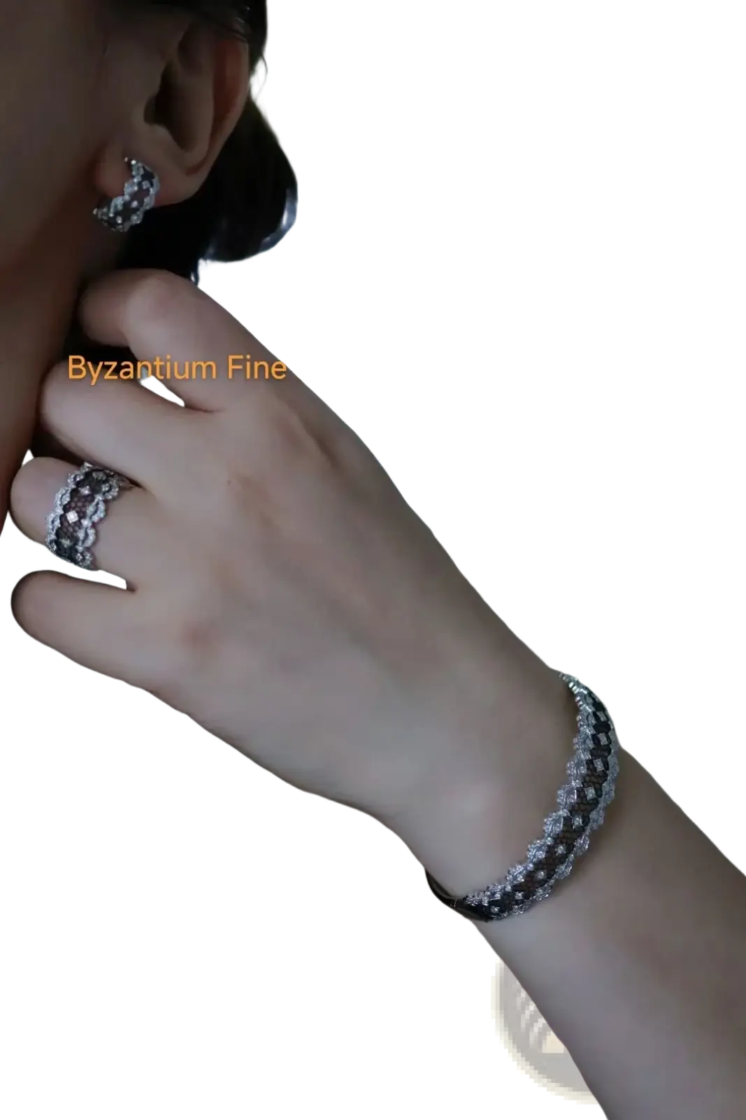 Silver-toned bracelet with textured pave-set diamond pattern complementing silver teardrop tassel earrings gold vermeil
