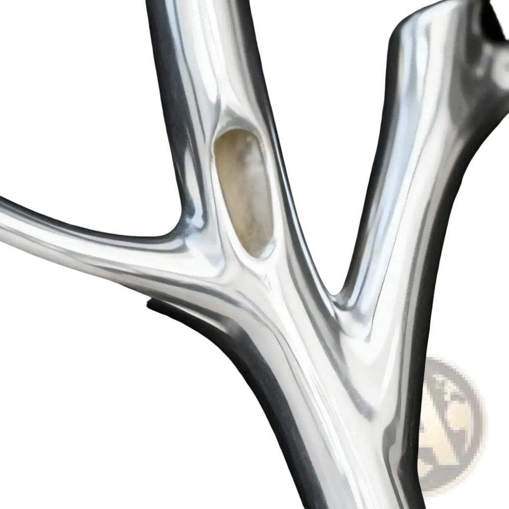 Silver tree branch brooch pin with sleek polished metal and embedded oval stone for fashion corsage use