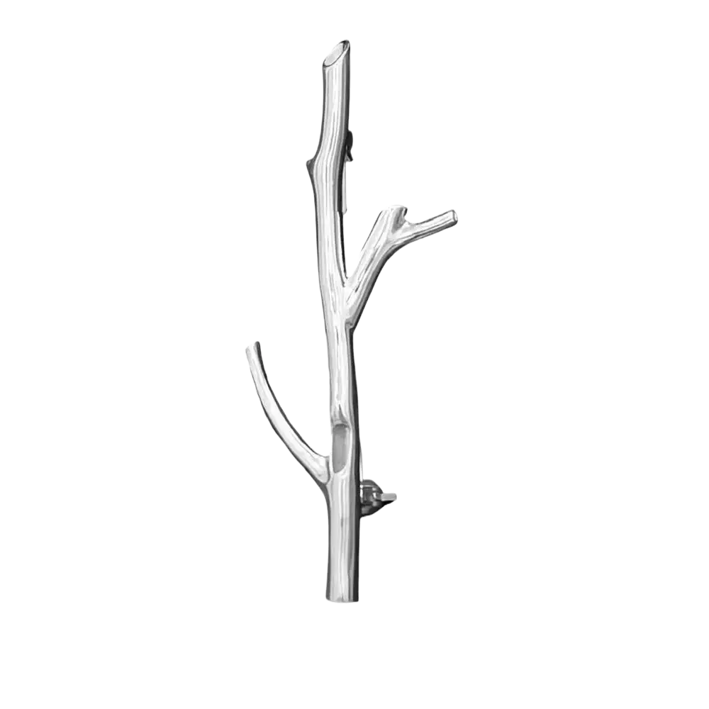 Silver tree branch brooch pin featuring an intricate silver metallic branch-shaped design with polished finish