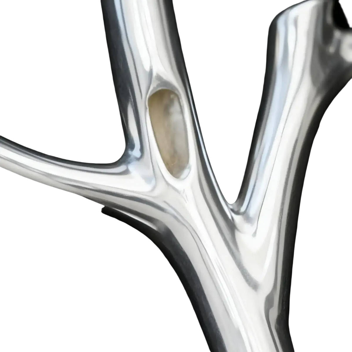 Silver tree branch brooch pin with sleek polished metal and embedded oval stone for fashion corsage use
