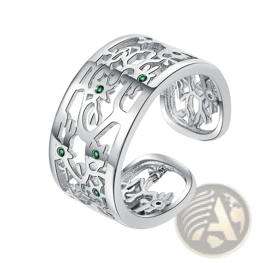 Silver tree of life open band ring with intricate filigree design and embedded green zircon gemstones in sterling silver