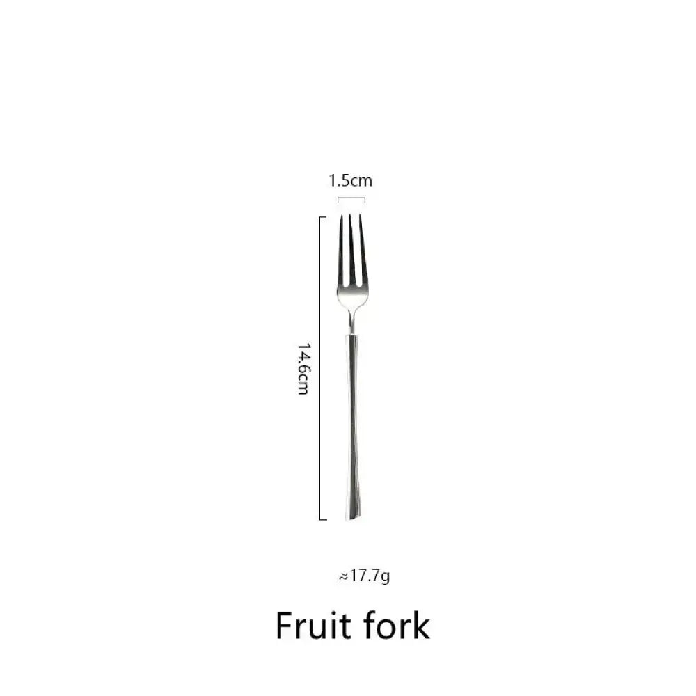 A sleek silver-toned fruit fork with slender handle and three tines from polished silver western stainless steel cutlery set
