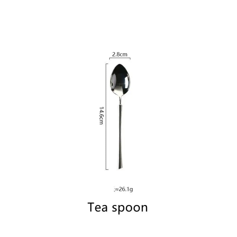 A sleek metallic tea spoon from the polished silver western stainless steel cutlery set with a slender handle