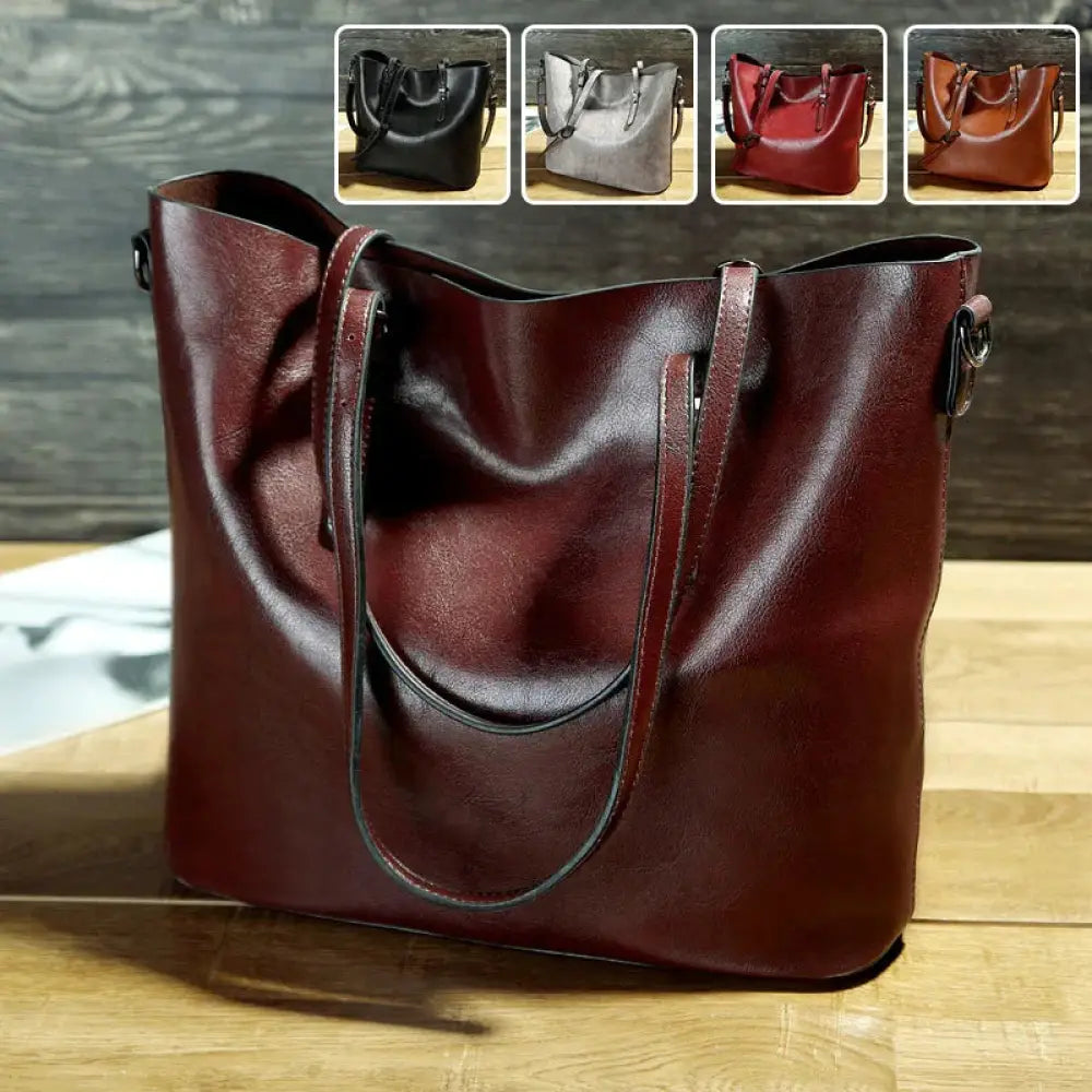 A rich burgundy vintage oil wax leather tote and shoulder bag with sturdy handles and minimalist design