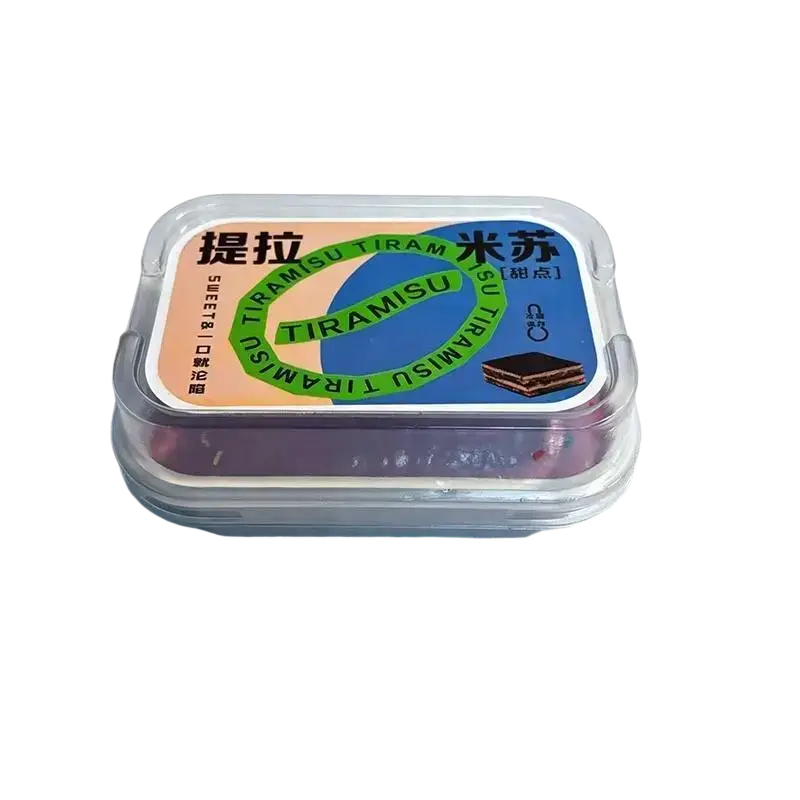 A clear plastic container holding a colorful branded simulated ice cream cake slow rising fidget toy with chinese characters