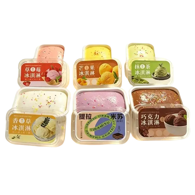 Six rectangular plastic containers of simulated ice cream cake slow rising fidget toy with colorful lids and labels