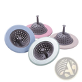 Pastel-colored silicone sink strainers with perforated designs and central drainage spouts for anti clogging kitchen use