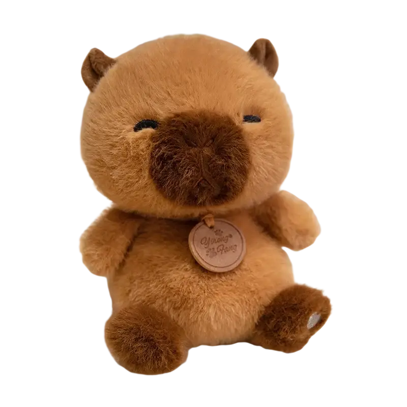 A soft plush brown capybara stuffed animal with a wooden capybara gang tag in sitting animals red panda fox sloth plush toys