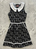 Black sleeveless retro skeleton print cotton A-line dress with white peter pan collar and trim featuring pockets