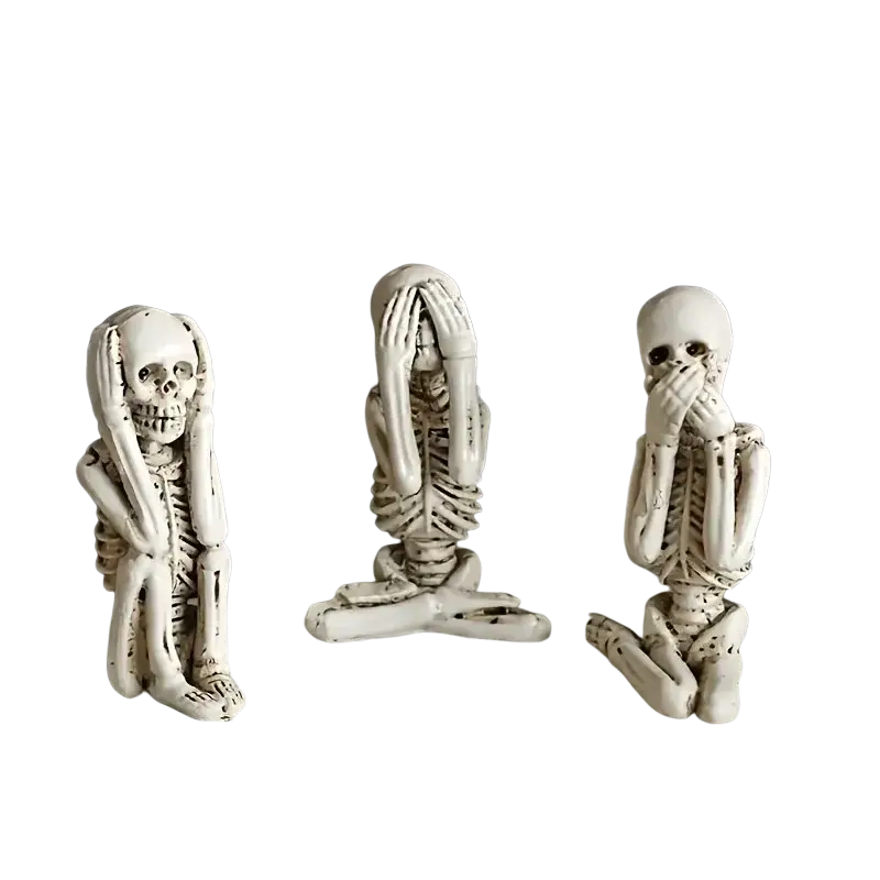 Three white resin skeleton decoration figurines in distinct poses representing the three wise skeletons set