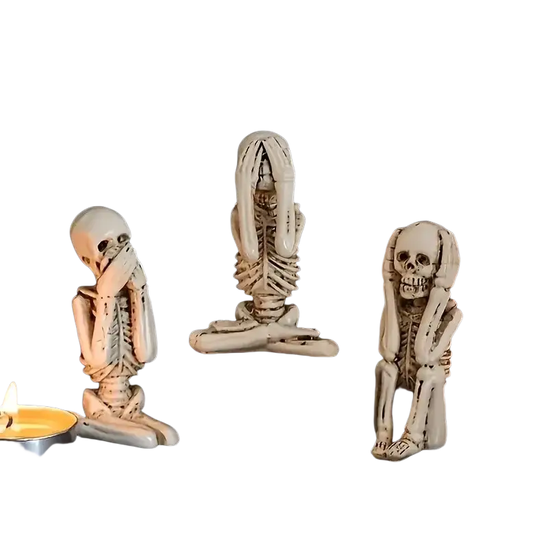 Three white resin skeleton decoration figurines in art deco style covering eyes ears and mouth three wise skeletons set