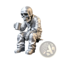 Silver skeleton office worker coffee figurine dressed in suit holding matching metallic mug in hand