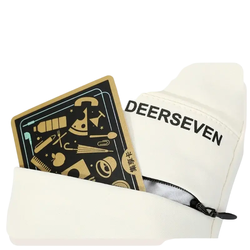 White fabric zipper storage pocket with black stitching and deerseven branding on ski mittens for cold weather use