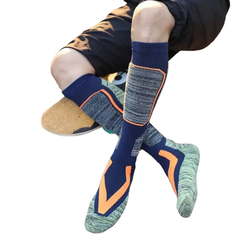 Navy blue and gray thermal ski socks with orange geometric accents and textured cotton knit for winter sports with tube height and foot length details