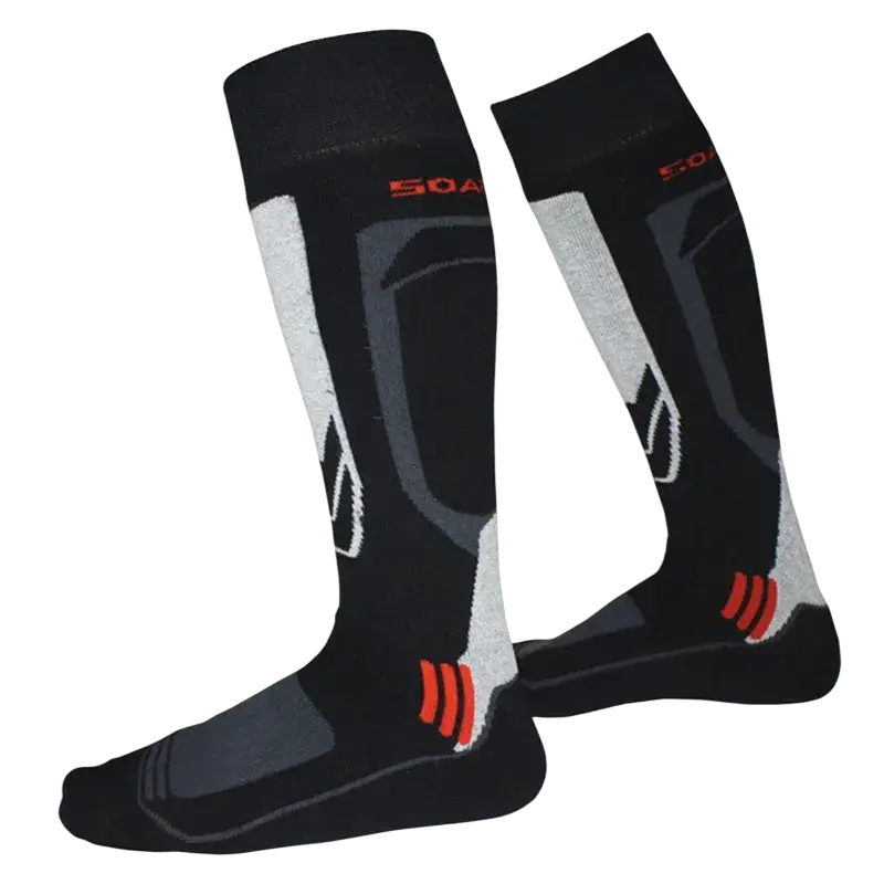 Black athletic ski socks made of thick cotton with gray white geometric patterns and red heel and toe accents for winter sports