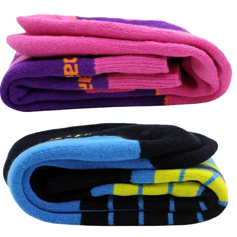 A pair of thick cotton thermal ski socks in vibrant pink purple and black blue yellow stripes for winter sports