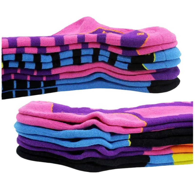 Stack of colorful patterned thick cotton ski socks in pink purple blue and black for winter sports and thermal use