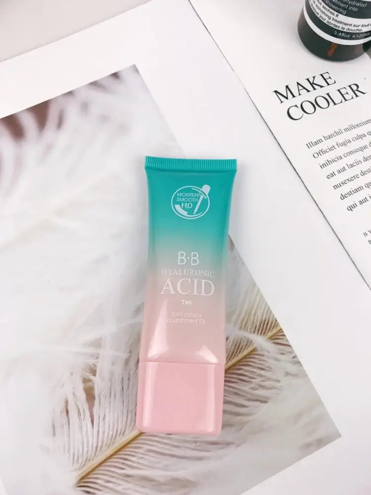 A gradient teal-to-pink squeeze tube of b b in a hyaluronic acid hydrating skincare gift set for glowing skin