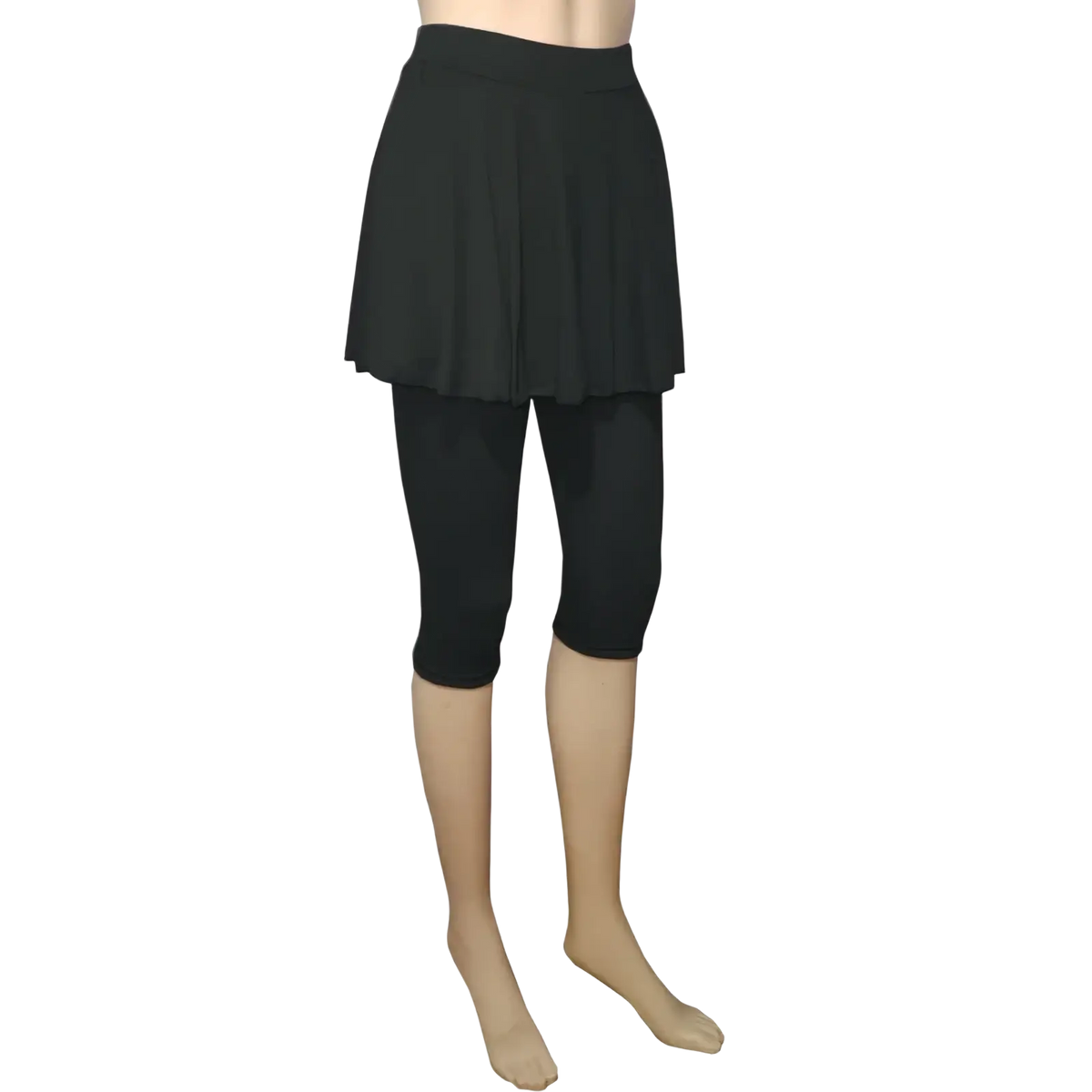 Black pleated skort leggings capris activewear pants featuring a skirt overlay on capri leggings front view