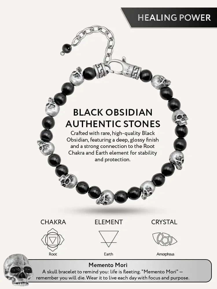A sleek black obsidian and silver skull beaded bracelet with a deep glossy finish and matching clasp