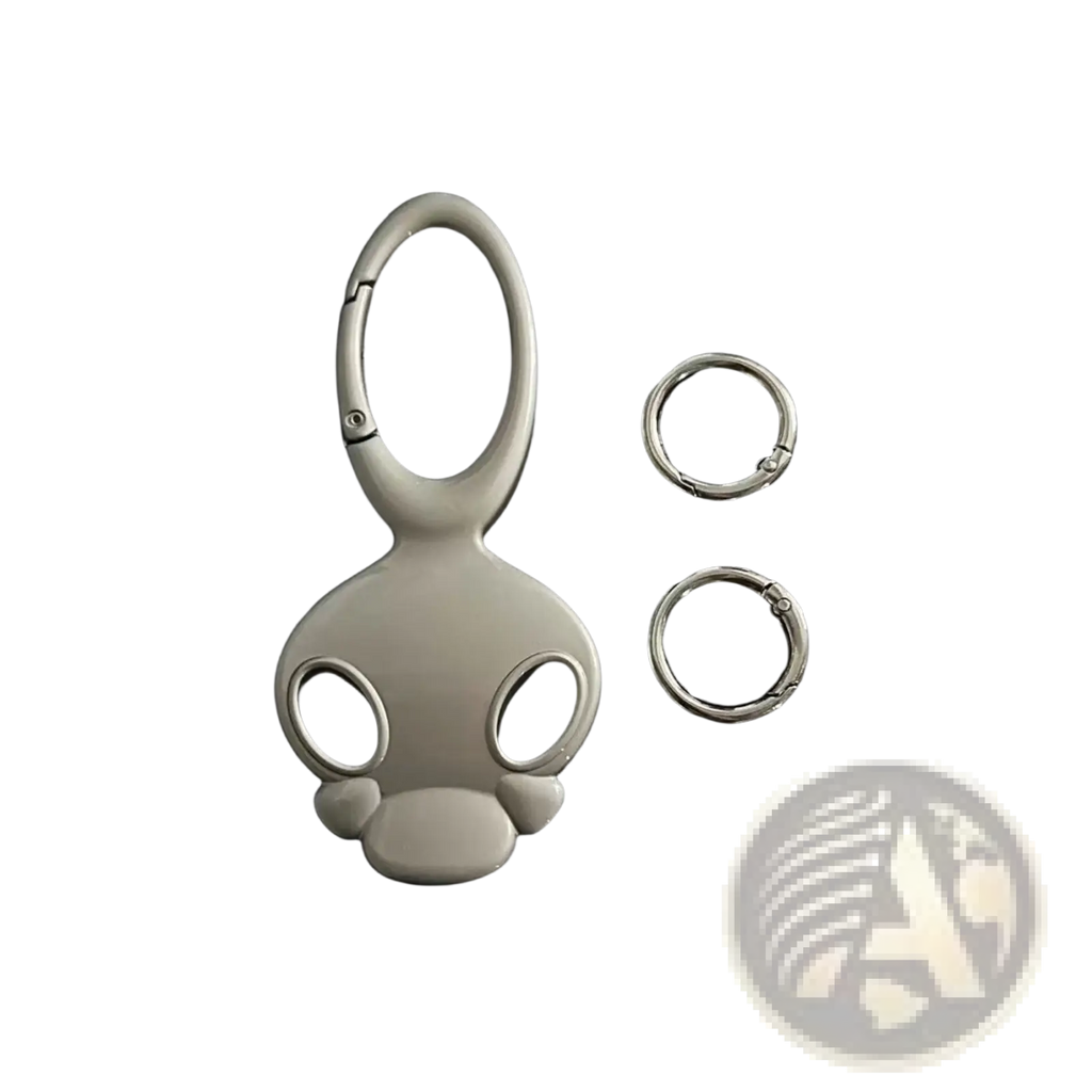 Silver-colored glossy metal skull keychain with stylized cartoon head design for car keys or bag charm
