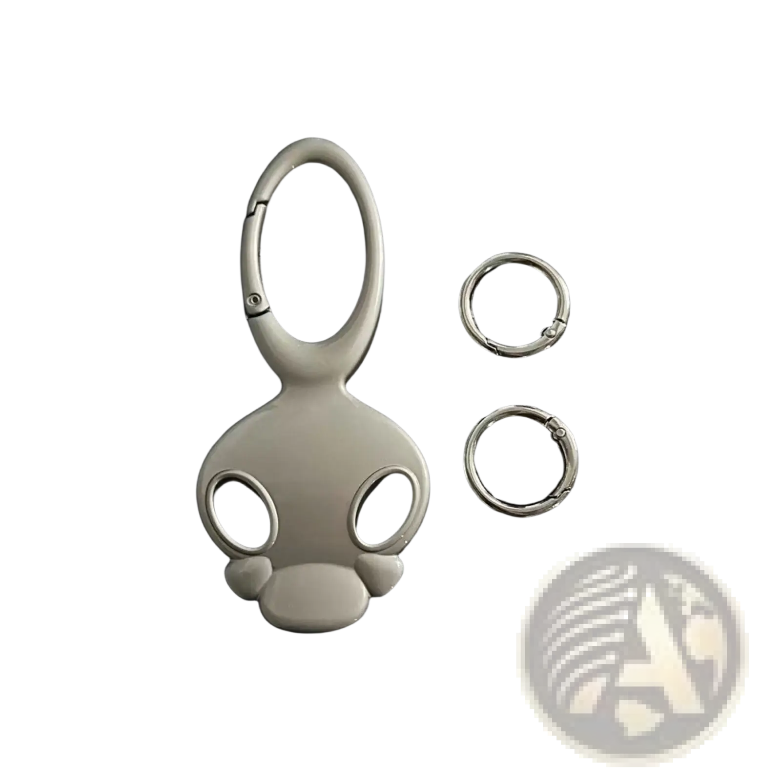 Silver-colored glossy metal skull keychain with stylized cartoon head design for car keys or bag charm
