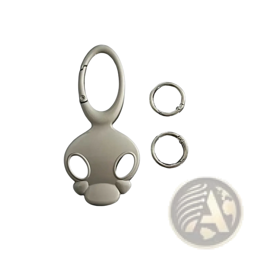 Silver metal skull keychain bag charm shaped like a monkey with a carabiner clip and two small rings