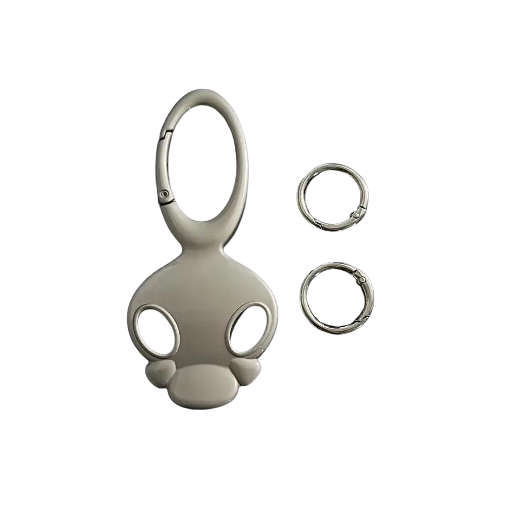 Silver metal skull keychain bag charm shaped like a monkey with a carabiner clip and two small rings