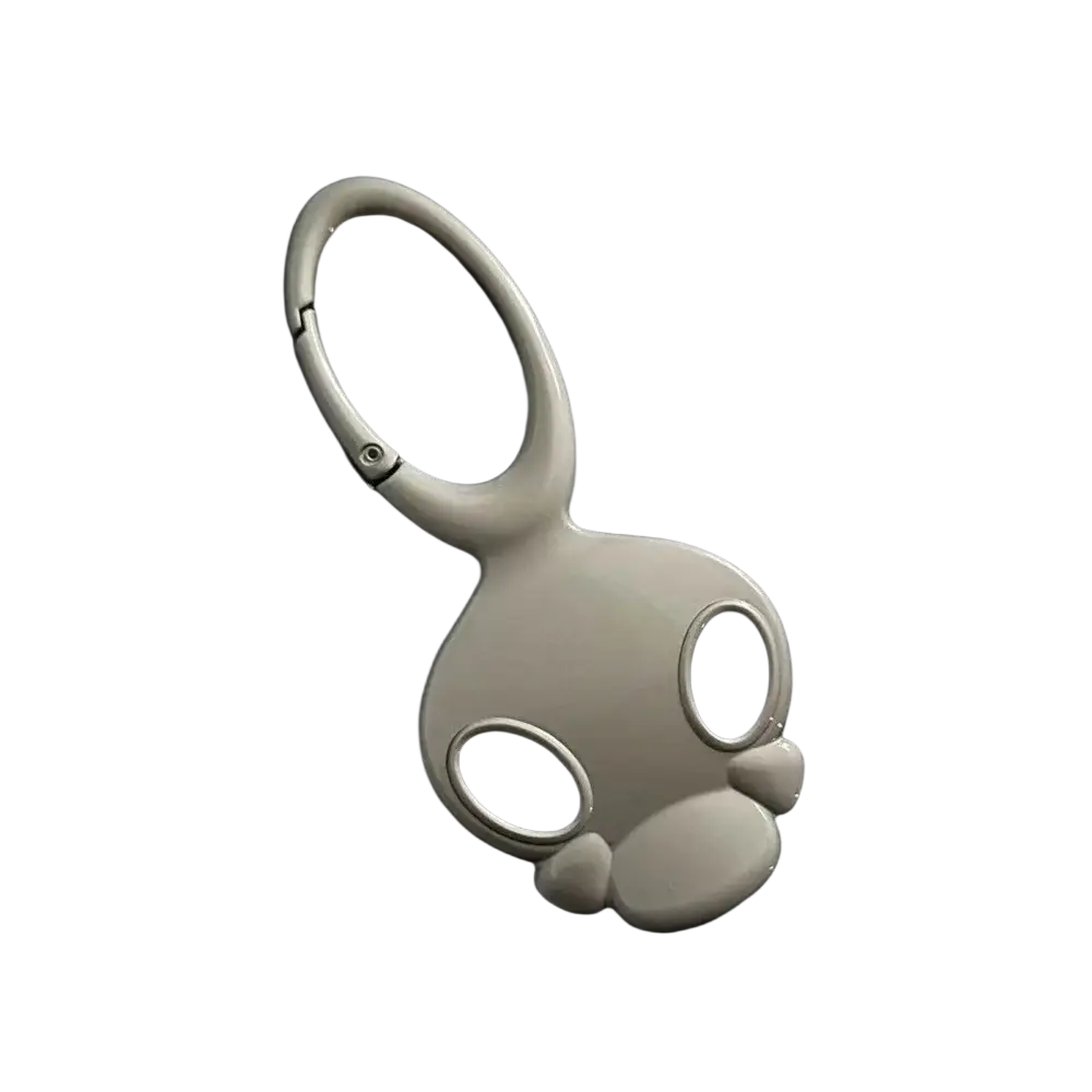 White ceramic skull metal car keychain bag charm shaped like a stylized bunny with large black eye cutouts and rounded ears