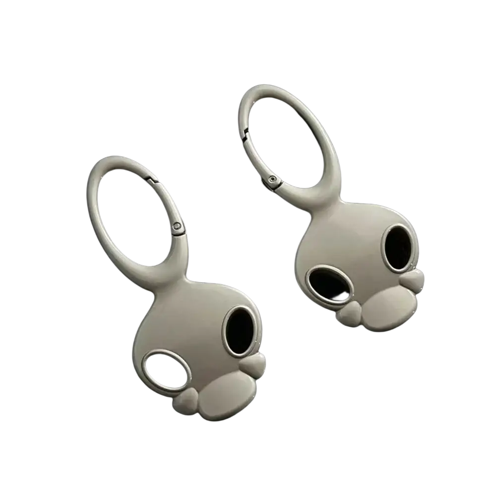 White enamel skull metal car keychain bag charm shaped like a rabbit with metallic accents and looped top