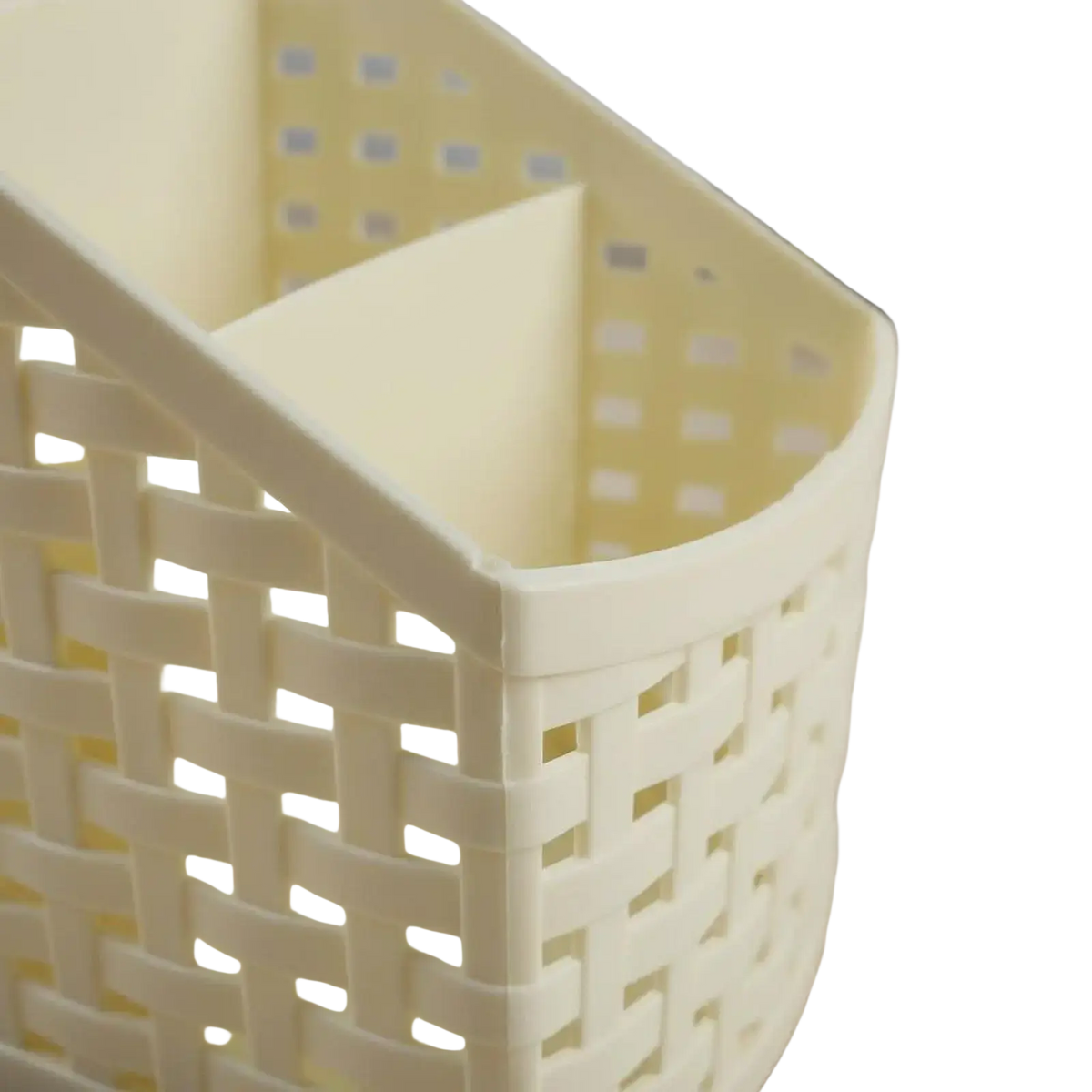 Cream-colored slanted woven plastic desk organizer with divided interior for efficient desk storage and organization
