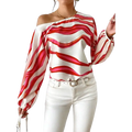 A white satin slash neck off shoulder blouse with bold red and pink wavy stripes and long puffed sleeve style