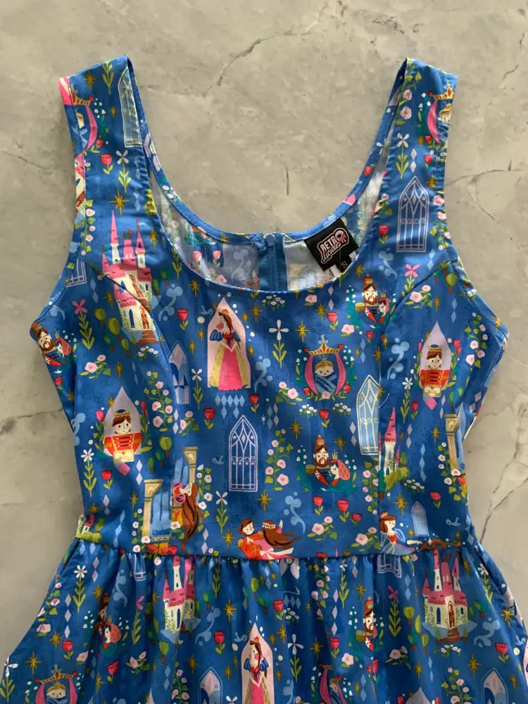 Sleeping Beauty cotton fit and flare dress with pockets in vibrant blue featuring disney princesses castles and floral motifs
