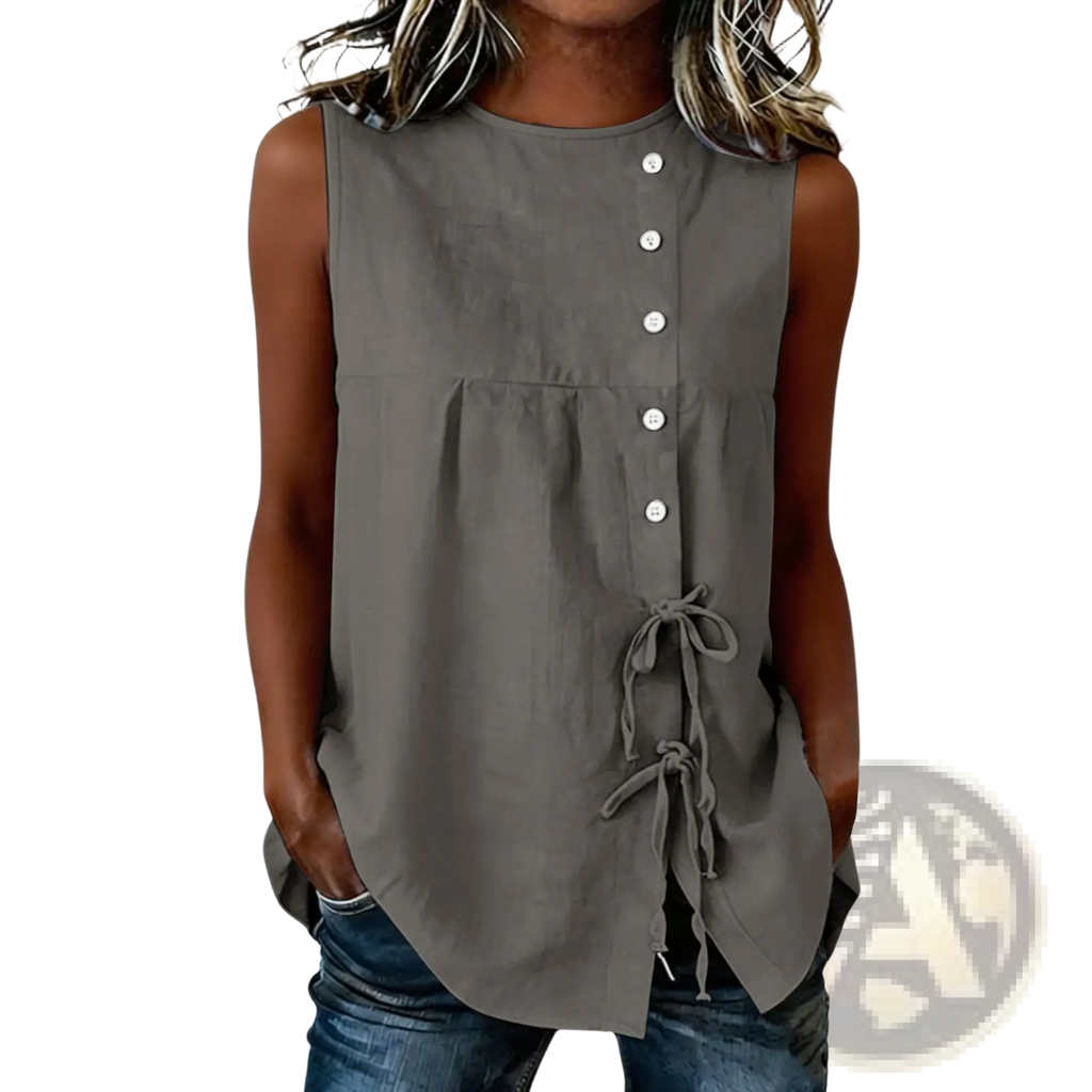 Gray sleeveless tie side button down blouse featuring white buttons and a tied waist detail in soft fabric