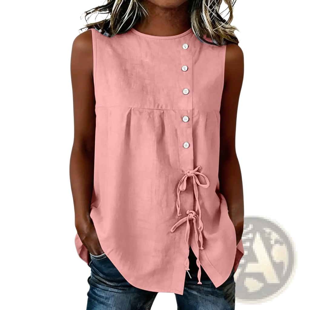 A soft pink sleeveless tie side button down blouse with front buttons and side tie details in lightweight fabric