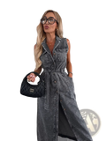 Black quilted leather miu miu handbag paired with sleeveless tie waist denim maxi dress with side slit