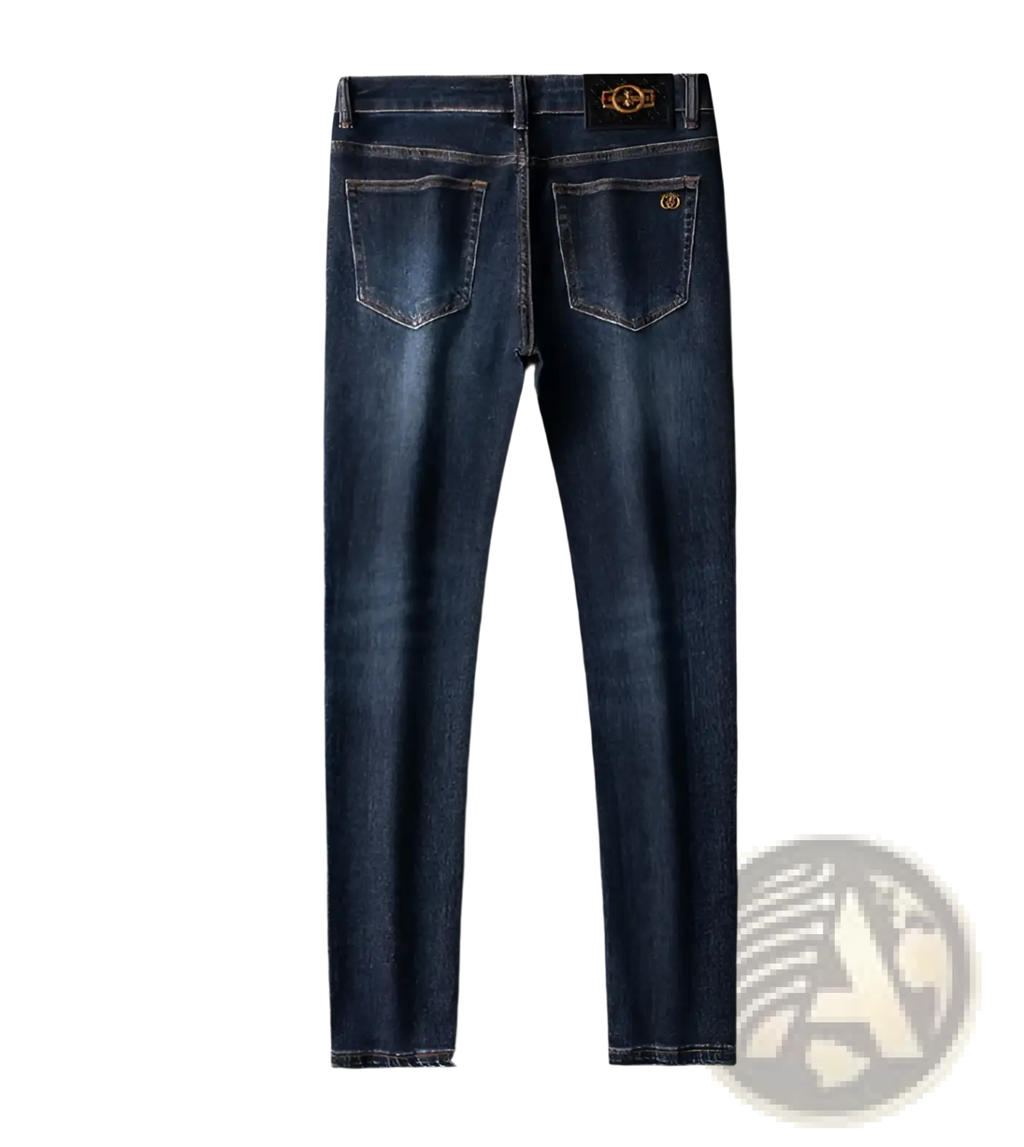 Back view of slim fit dark blue denim jeans men with gold tone branding on waistband and rear pocket