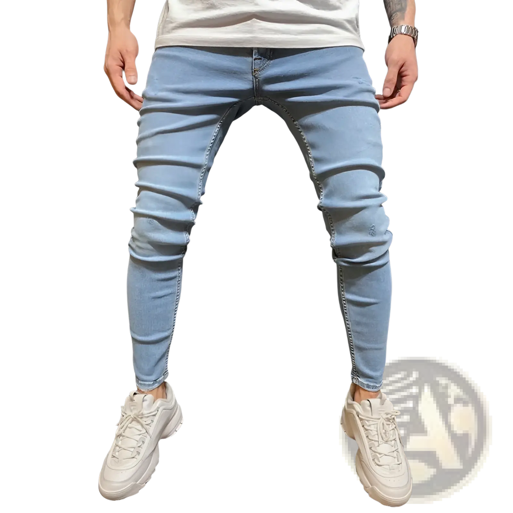Slim fit light wash distressed denim jeans featuring a slim-fit cut and subtle fading details in light-wash denim