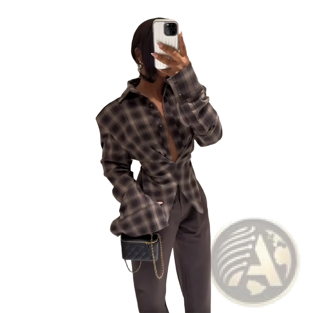 Black quilted leather chain strap crossbody bag shown with slim fit plaid shirt for stylish casual wear