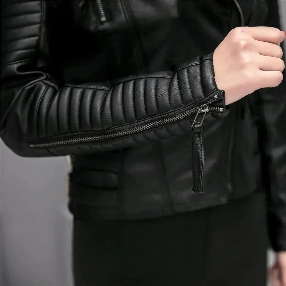 Black slim fit quilted faux leather women’s motorcycle jacket with zipper detail on the sleeve