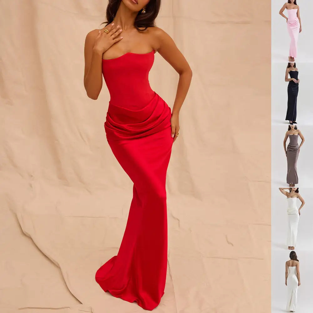 A vibrant red satin strapless backless mermaid evening gown with a fitted bodice and flowing skirt