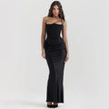 Black satin strapless backless mermaid evening gown with a cinched waist and draped detail