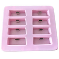 Pink silicone slimevr charging dock with eight rectangular compartments holding silver usb-c connectors