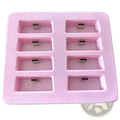 Pink silicone slimevr charging dock with eight rectangular compartments holding silver usb-c connectors