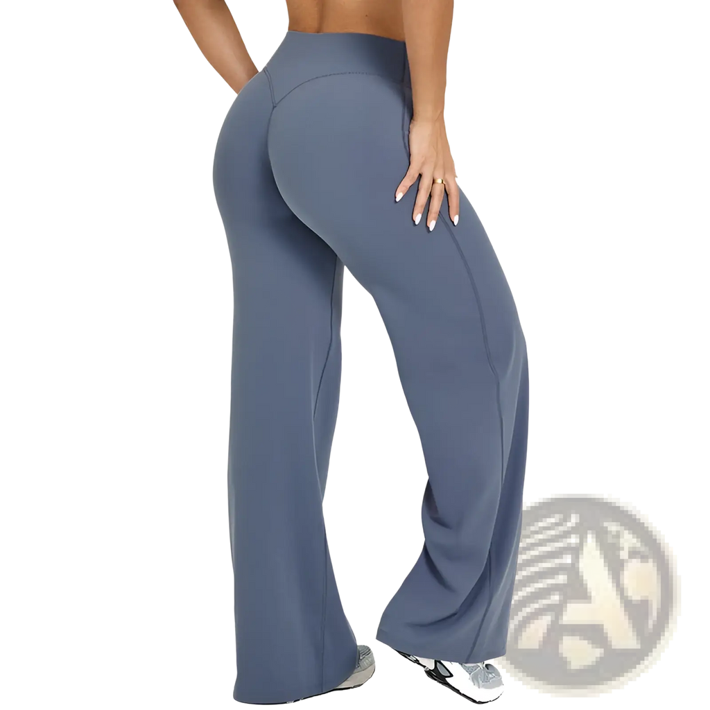 A pair of slimming yoga pants high waisted straight leg in solid slate blue with smooth stretchy fabric and side seam detailing
