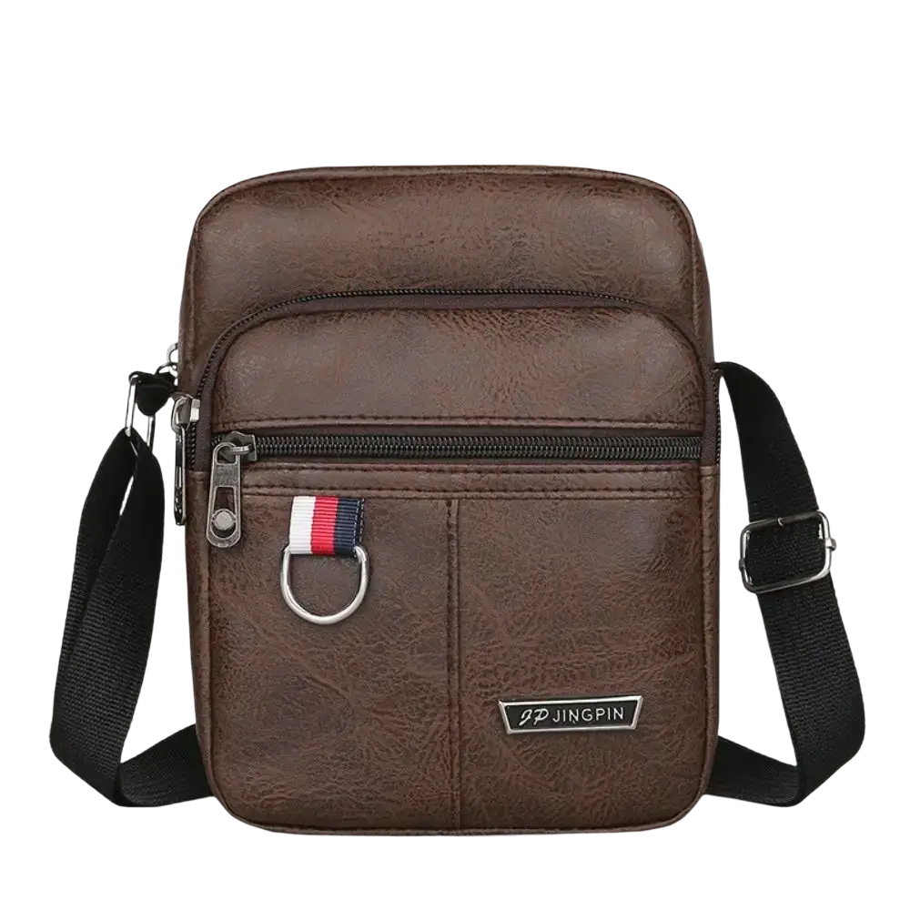 Brown textured leather sling bag messenger with black adjustable strap and silver hardware for casual use