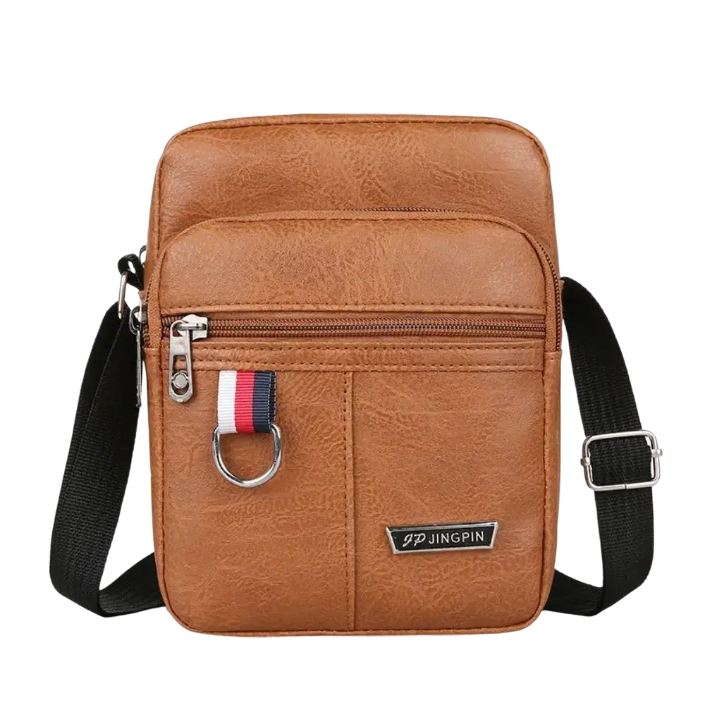 Brown faux leather sling bag messenger with black adjustable strap and silver hardware for casual use