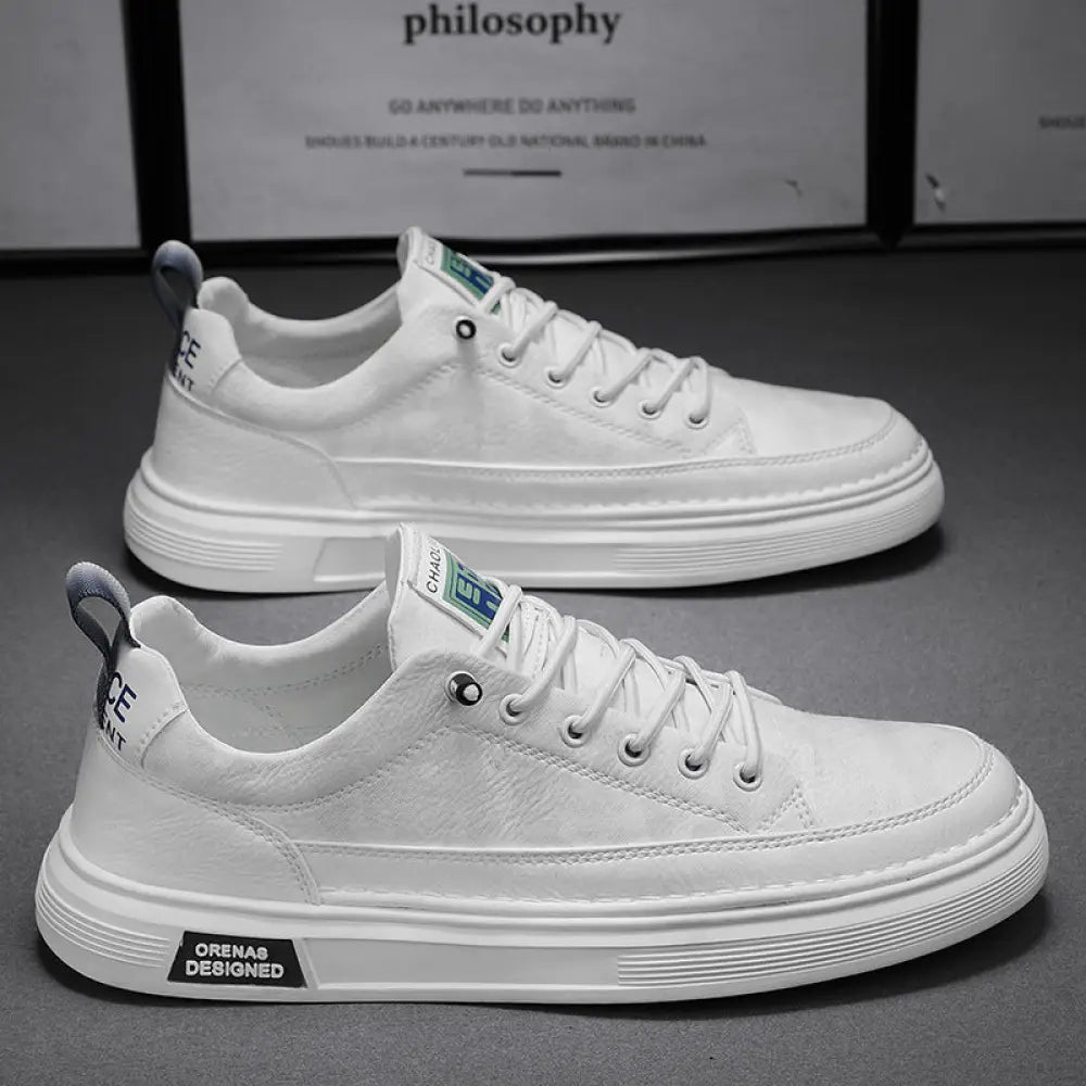 Men’s casual suede and leather slip-on sneakers with white canvas upper and chunky white rubber sole featuring subtle branding details