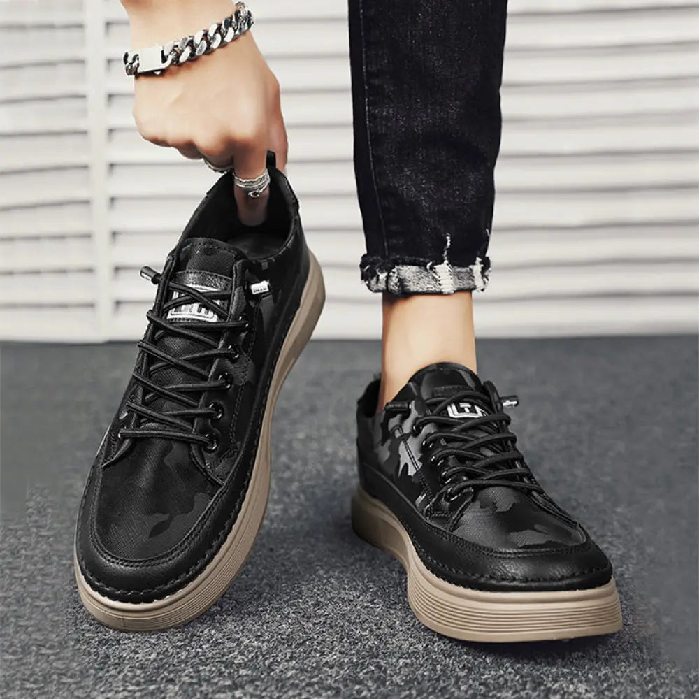 Men’s casual suede and leather slip-on sneakers in black camouflage pattern with chunky beige rubber sole